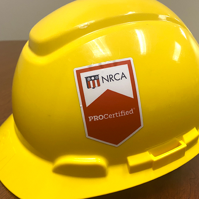 Yellow hard hat with a PROcertification sticker
